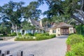 Street view of an old house with a large courtyard in Carmel-by-the-Sea