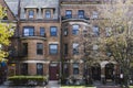 Street view of an old, red brick apartment building in Boston. Row of brownstones Royalty Free Stock Photo