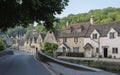Street view of old riverside cottages in the picturesque Castle Combe Village, Cotswolds, Wiltshire, England - UK Royalty Free Stock Photo