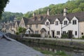 Street view of old riverside cottages in the picturesque Castle Combe Village, Cotswolds, Wiltshire, England - UK Royalty Free Stock Photo