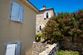 street view of the old town of Budva in Montenegro, medieval European architecture, city streets, windows with wooden shutters, Royalty Free Stock Photo