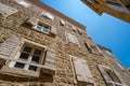 street view of the old town of Budva in Montenegro, medieval European architecture, city streets, windows with wooden shutters, Royalty Free Stock Photo