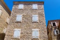 street view of the old town of Budva in Montenegro, medieval European architecture, city streets, windows with wooden shutters, Royalty Free Stock Photo