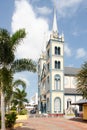 Street view in Paramaribo, Surinam with wooden colonial houses and church