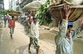 Street view with porters and rickshaws, Dhaka Royalty Free Stock Photo