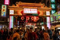 Street view of Raohe Street food Night Market full of people and