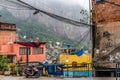 Urban street view of slums and shanty houses with a parked scooter in Rocinha favela in Rio de Janeiro, Brazil, South America