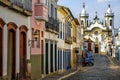 Street view of Sao Joao del Rei with Nossa Senhora do Carmo Church on backgound - Sao Joao Del Rei, Minas Gerais, Brazil Royalty Free Stock Photo