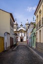 Street view of Sao Joao del Rei with Nossa Senhora do Carmo Church on backgound - Sao Joao Del Rei, Minas Gerais, Brazil Royalty Free Stock Photo