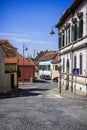 Street view of sibiu old town with coble stone road and vintage lamp posts Royalty Free Stock Photo