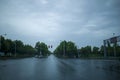 Street view taken through the windshield of the car in rainy weather Pedestrian crossing Royalty Free Stock Photo