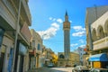 Street view with tall minaret in old town Nabeul. Tunisia, Nort Royalty Free Stock Photo