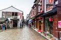 Street view with wooden historic buildings in Zhujiajiao in a rainy day, an ancient water town in Shanghai, built during Ming and