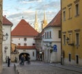 A street view in Zagreb`s upper town with historic stone gate and Cathedral towers on background, Croatia Royalty Free Stock Photo