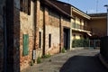 Street in a village with old brick houses on a sunny day in the italian countryside Royalty Free Stock Photo