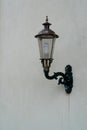 Street vintage lantern on old light embossed wall. Royalty Free Stock Photo