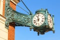 Street vintage watches hanging on a brick building. Royalty Free Stock Photo