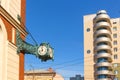 Street vintage watches hanging on a brick building. Royalty Free Stock Photo