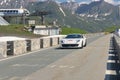 In the street a white Ferrari take part in the CAVALCADE 2018 event along the roads of Italy, France and Switzerland around MONTE