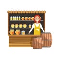 Street wooden counter with jars of sweet honey and female seller in apron.