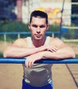 Street workout, portrait sporty man relaxing after training