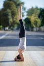 Street yoga: salamba shirshasana Royalty Free Stock Photo