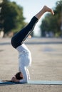 Street yoga: supported headstand yoga pose Royalty Free Stock Photo