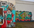 Streetart: boy dressed as a king with a large crown on his head