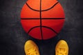Streetball player standing directky above ball Royalty Free Stock Photo