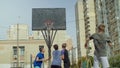 Streetball players figthing for rebound on court