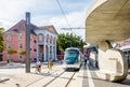 A streetcar is arriving at Kehl Rathaus station in front of the town hall of Kehl, Germany