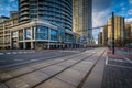 Streetcar tracks and modern buildings along Queens Quay West, at