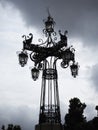 Streetlamp against cloudy sky