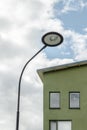 Streetlamp and facade of a green house