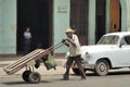 Streetlife at Cuba with man with pushcart Royalty Free Stock Photo