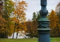 architecture detail autumn park metal streetlight trees lake sky yellow leaves nature