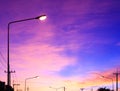 Streetlight with highlight on fantasy sky background and pink clouds after sunset