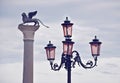 Streetlight and Winged Lion Column in St. Mark's Square in Venice Royalty Free Stock Photo