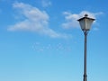 streetlights with lots of coloured birds