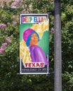 Streetpole banner in Deep Ellum, Texas, designed by local artist Ebony Lewis in honor of Black History Month in February, 2021.