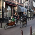 Streets of Amsterdam with bikes and people on 29 June 2013. Amsterdam is the capital and most populous city of the Netherlands