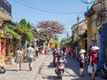 The streets of ancient town of Hoi An in central Vietnam, old houses and lanterns of various colors, busy streets full of people