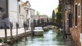 Streets and canals of Venice, Italy Ancient houses , flowers in the windows and the sea