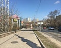 The streets of the city of Donetsk. Cars on the road. High-rises on the horizon.