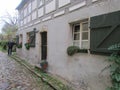 Streets of European cities - Maison, Germany.Old house with shuttered windows and street lamps.