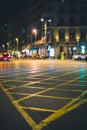 Streets intersection painted in yellow in the city during night