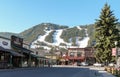 Streets of Jackson Hole with ski slopes at background