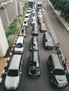 The streets of Jakarta are very congested and full of cars near traffic lights