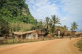 Streets of the Lao village of Vang Vieng, popular among tourists. With village typical Asian houses