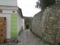 The streets of medieval Bohemia - paving stones, walls of wild stone, crooked streets.